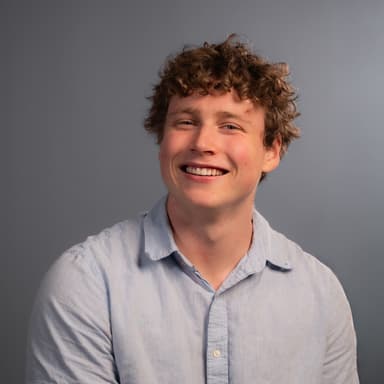 Photo of Simon Risk with head tilted